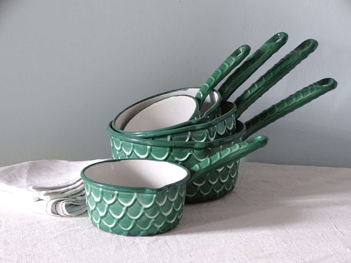 Set of French vintage green enamelware pans with a fish scale pattern