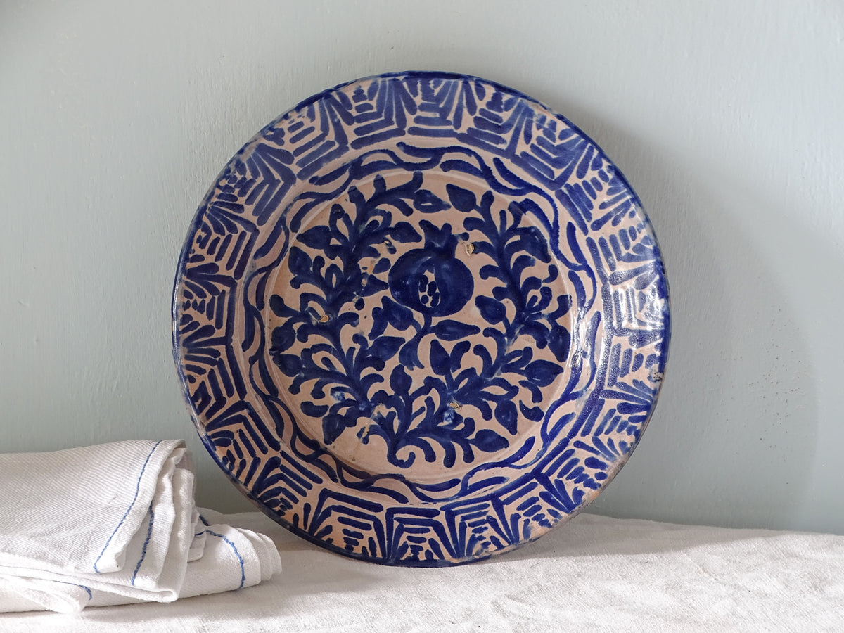 Spanish antique fajalauza pottery bowl with hand-painted blue pomegranate 