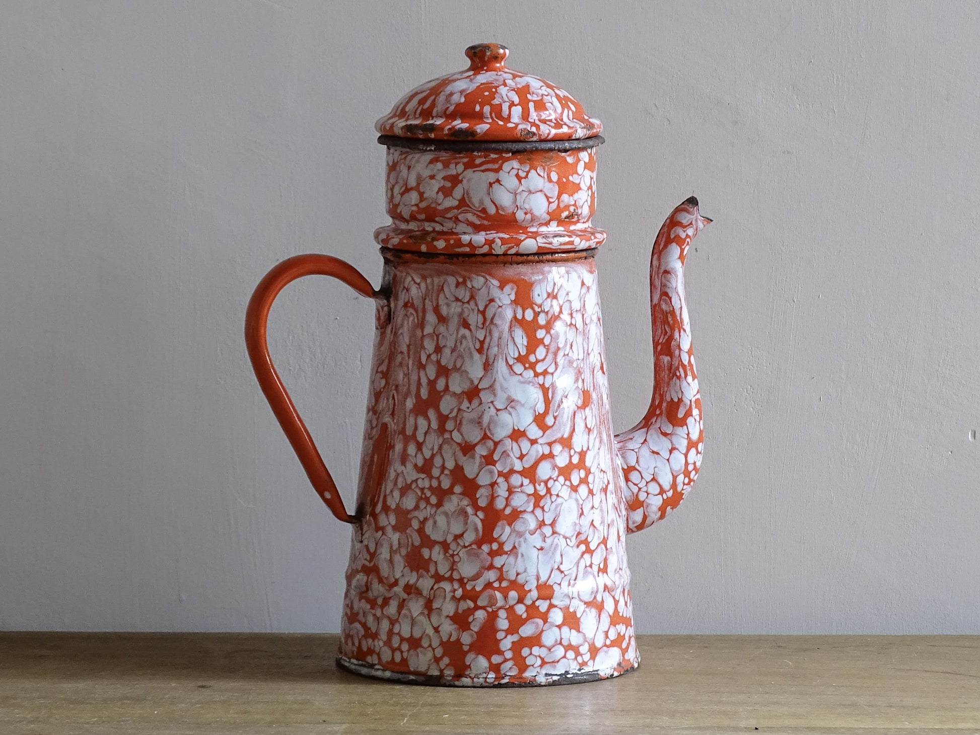 french vintage enamelware coffee pot in red and white marble effect