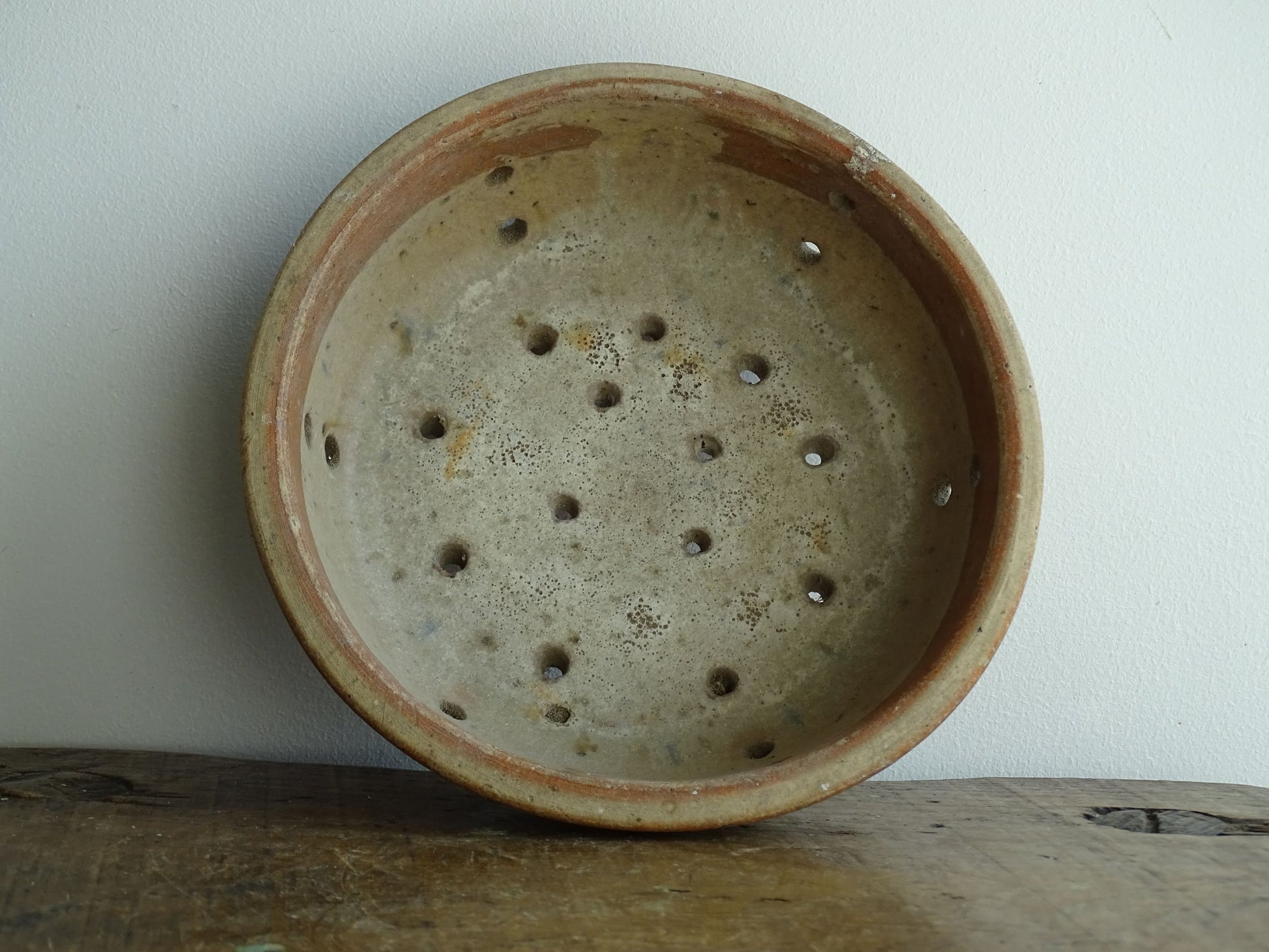 French antique terracotta faisselle cheese strainer. Rustic French pottery sieve for a French farmhouse kitchen.