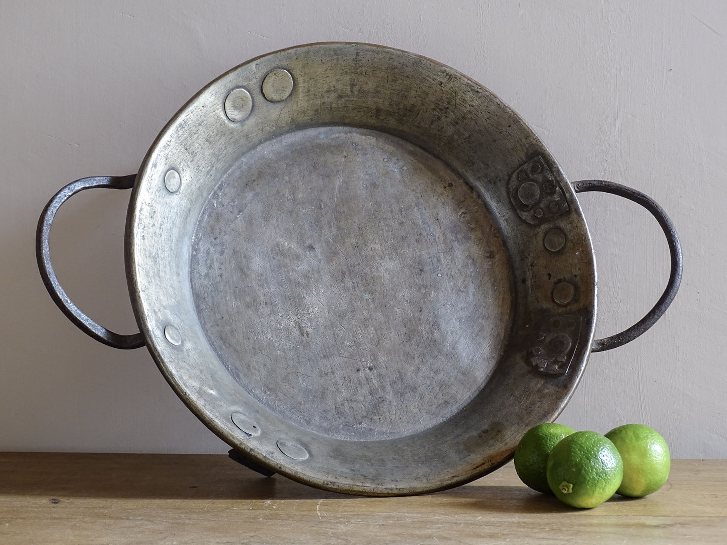 French antique copper pan with cast iron handles and feet