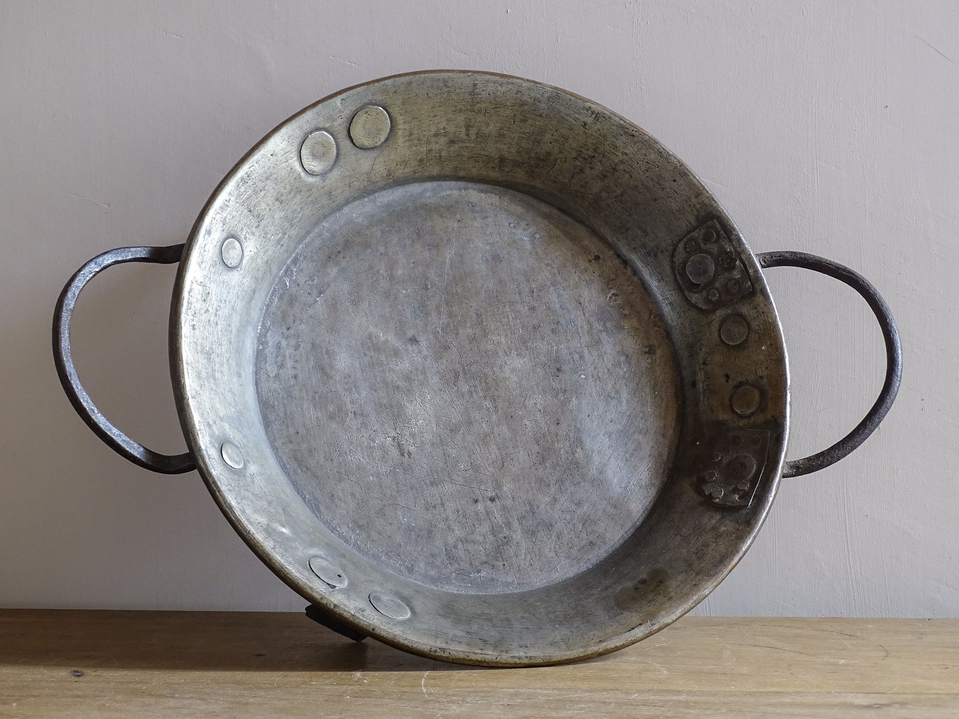 French antique copper pan with cast iron handles and feet