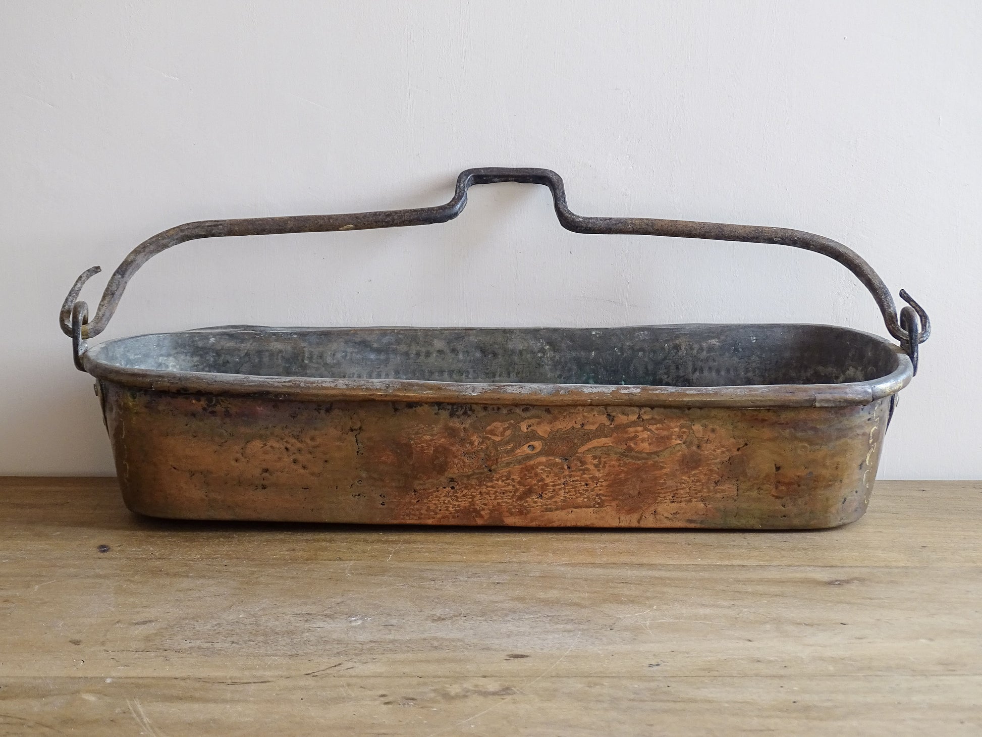 French antique copper fish poacher or poissoniere with hammered copper body and wrought iron handle