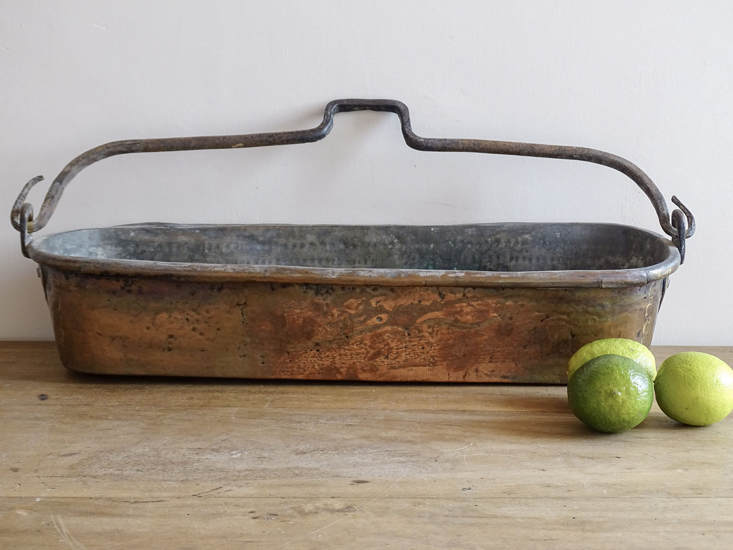 French antique copper fish poacher or poissoniere with hammered copper body and wrought iron handle