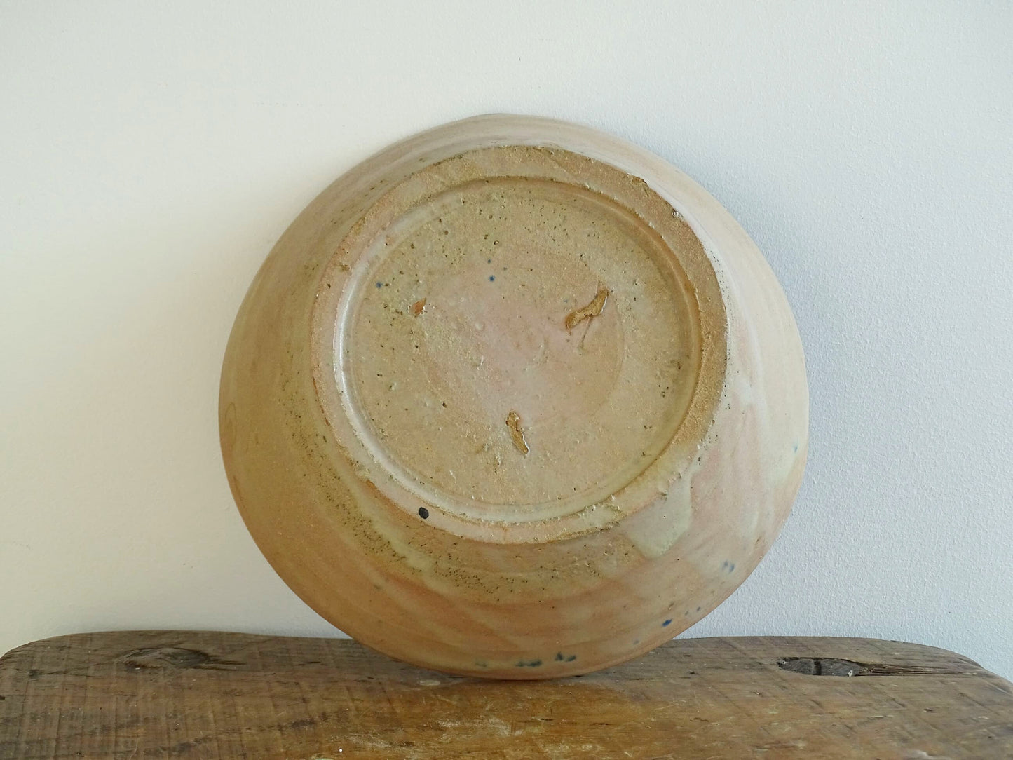 Spanish antique Fajalauza ceramic lebrillo from Granada. Terracotta ottery bowl with a pink tone and hand-painted blue star-shaped flower. Deep bowl for antique wall. Antique Mediterranean decor, decorative bowl. 