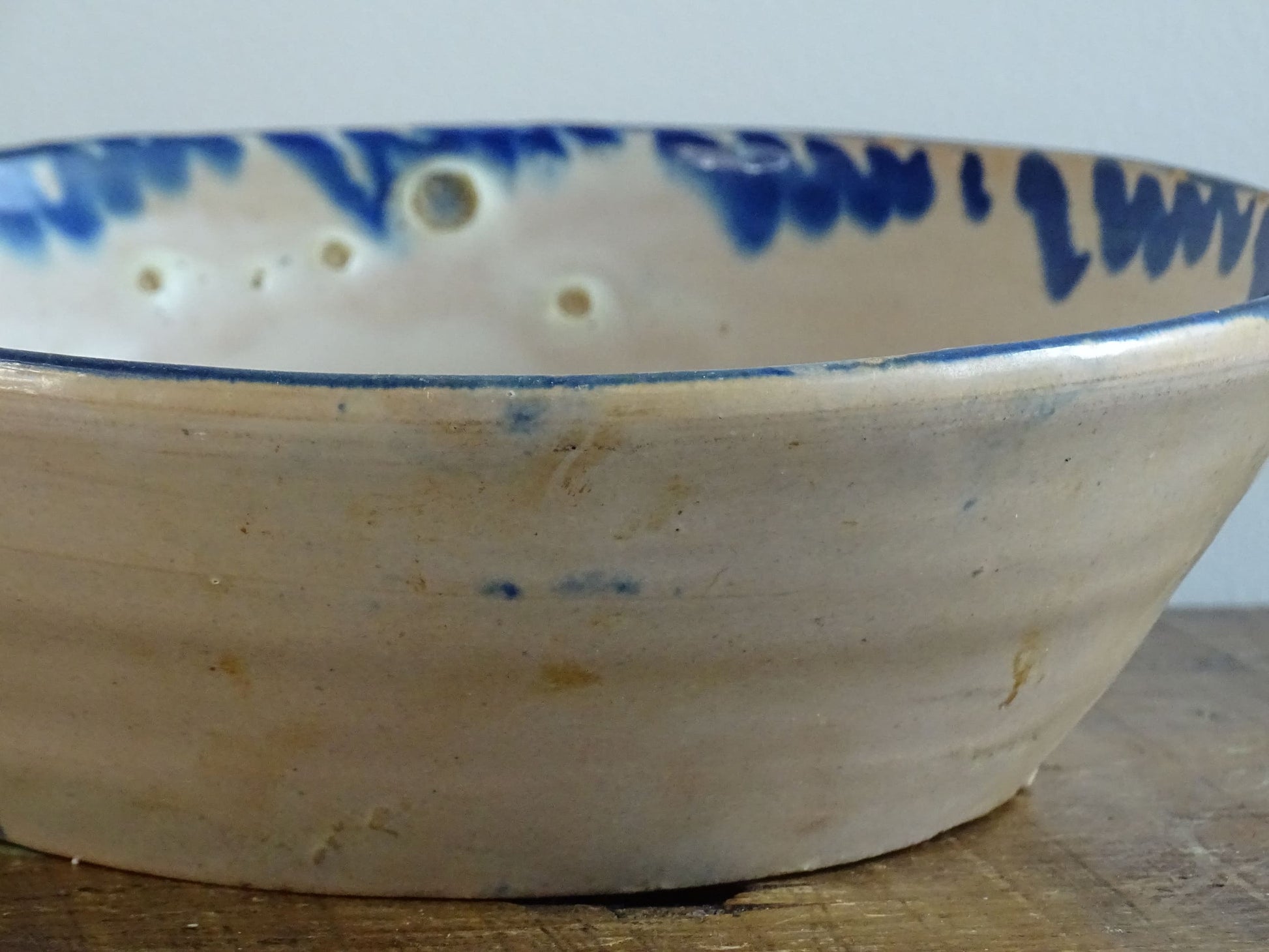 Spanish antique Fajalauza pottery lebrillo from Granada. Tin glazed terracotta bowl, hand-painted with blue leaves and flowers.