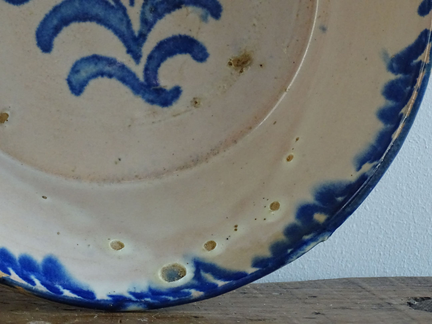 Spanish antique Fajalauza pottery lebrillo from Granada. Tin glazed terracotta bowl, hand-painted with blue leaves and flowers.