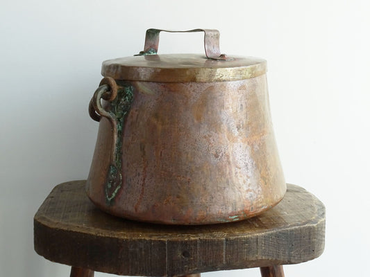 French antique copper cauldron with lid and patina. Old copper cauldron with wrought iron handle for rustic farmhouse decor.