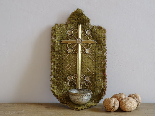 French antique cross with benitier on a stitched felt background, backed by silk. It has small gilt metal flowers adorning the cross and above the basin (benitier).  Religious decor for the wall or holy water font. 