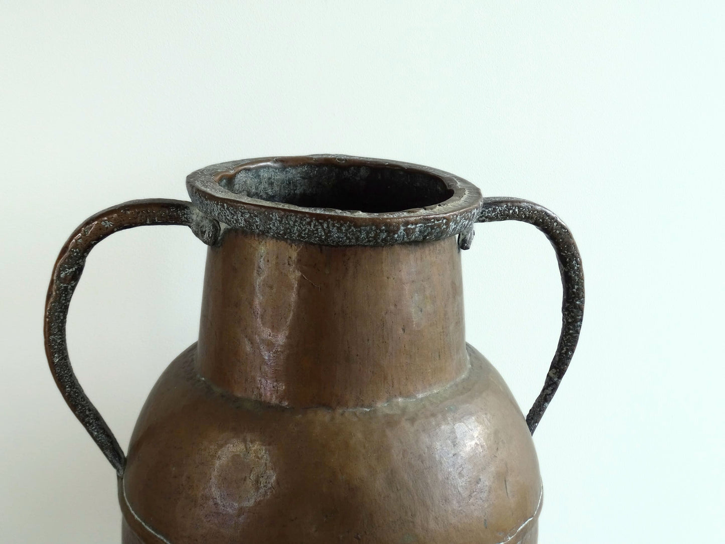 A large 18th-century antique copper water pot from Normandy with a rounded form and double handles, showcasing a warm aged patina