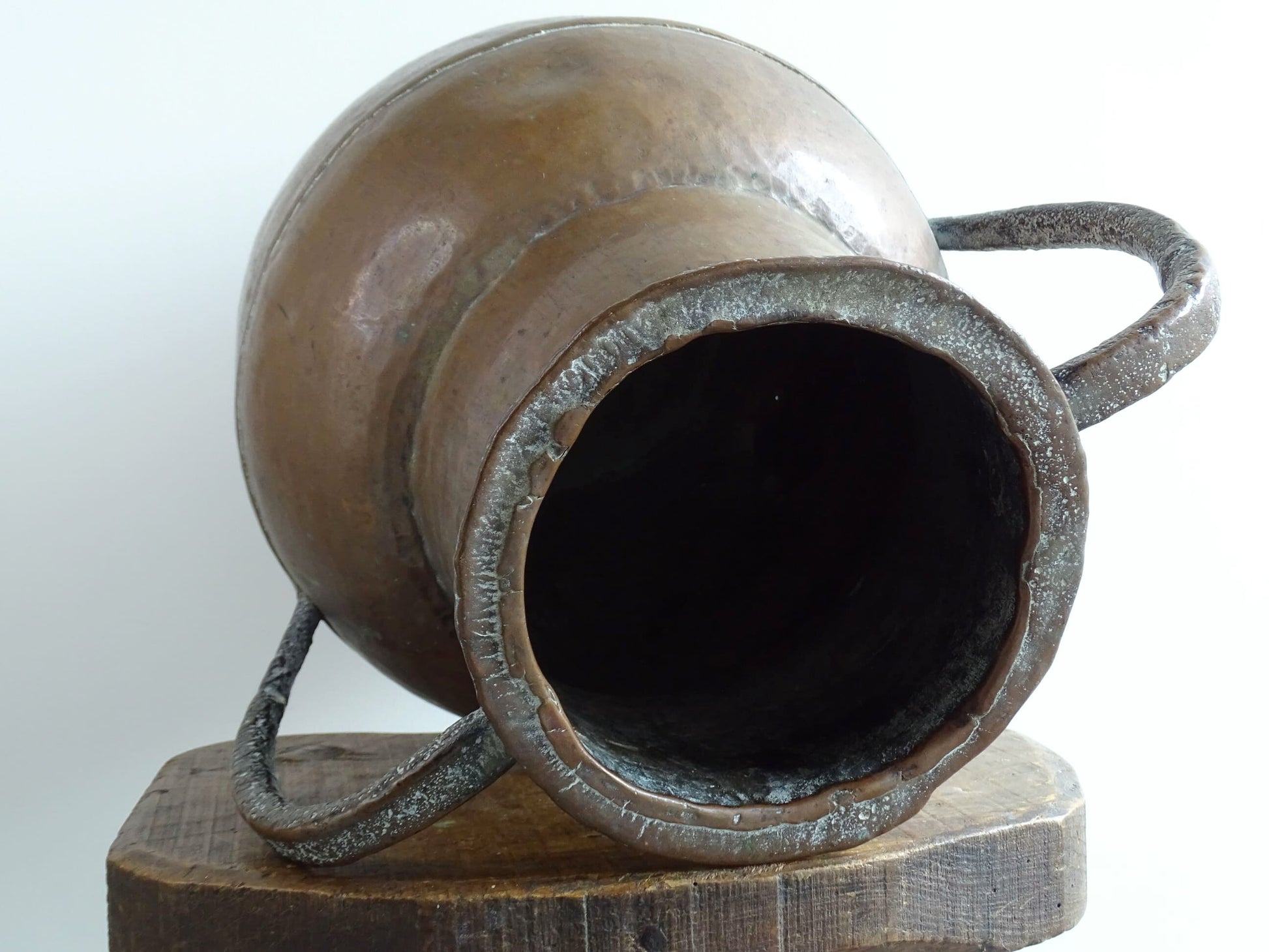 A large 18th-century antique copper water pot from Normandy with a rounded form and double handles, showcasing a warm aged patina