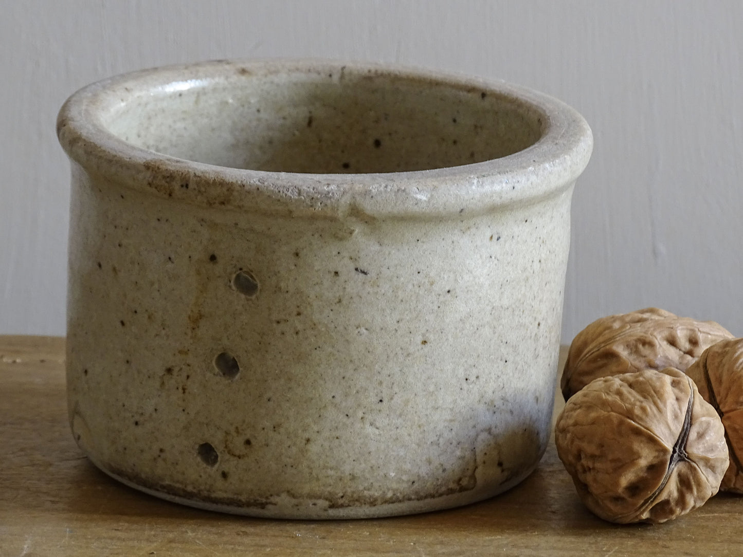 Rustic French antique ceramic faisselle with beige glaze
