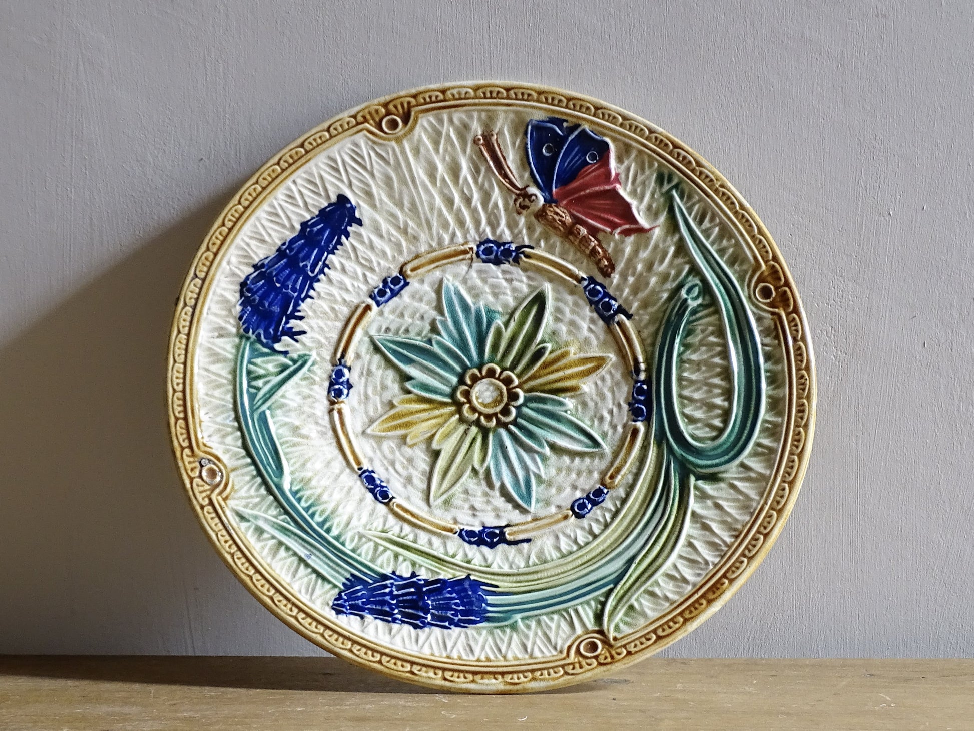 French antique barbotine majolica plate with floral and leaf motif
