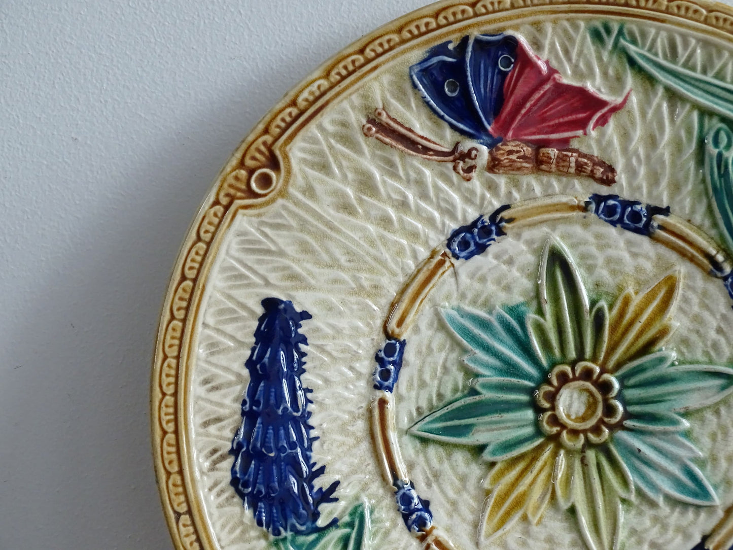 French antique barbotine majolica plate with floral and leaf motif