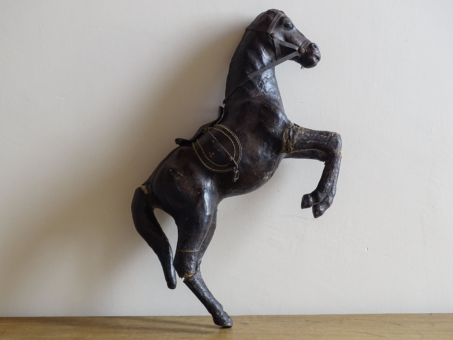 Distressed antique leather horse figurine for vintage shelf decor
