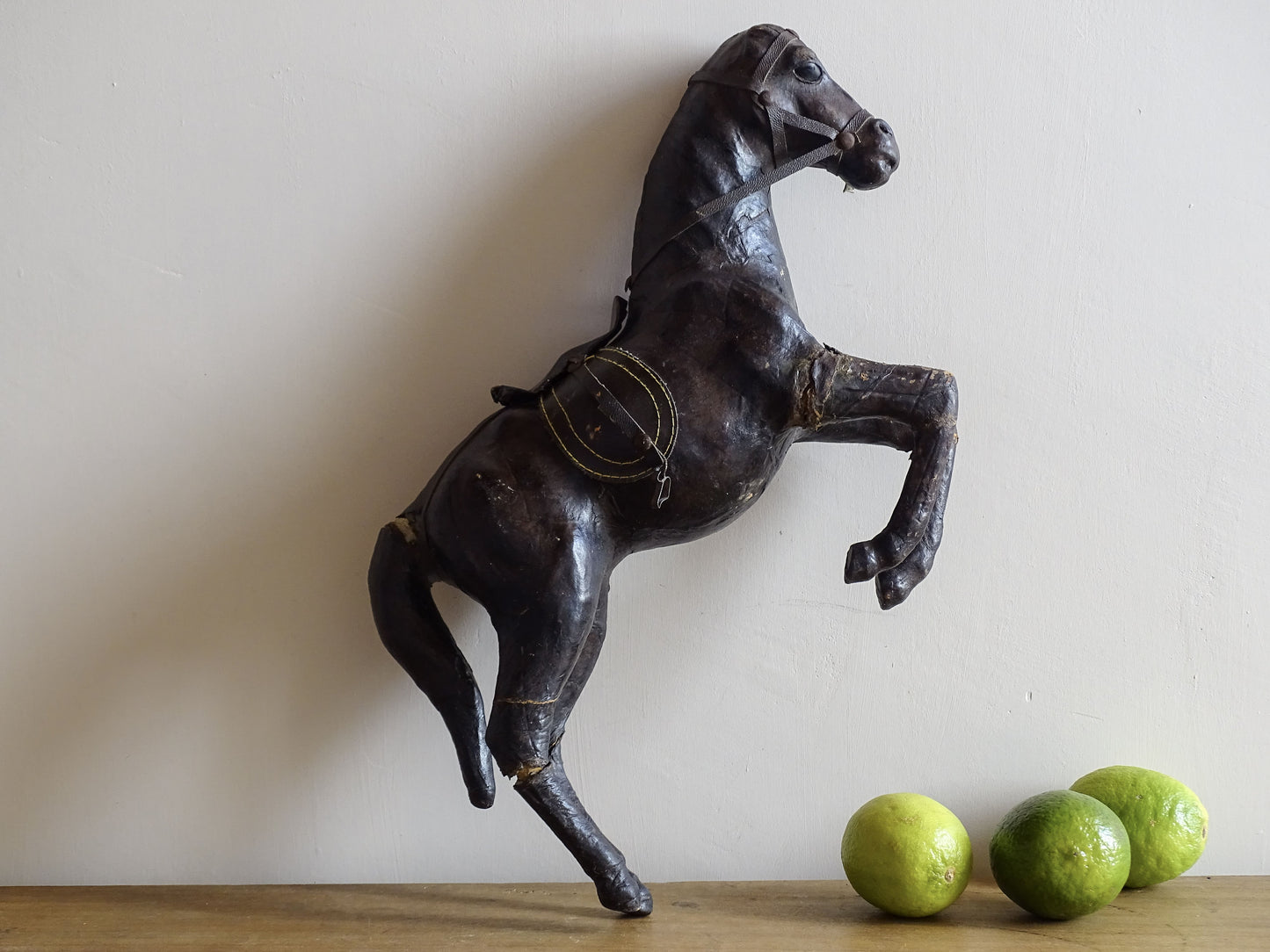 Distressed antique leather horse figurine for vintage shelf decor