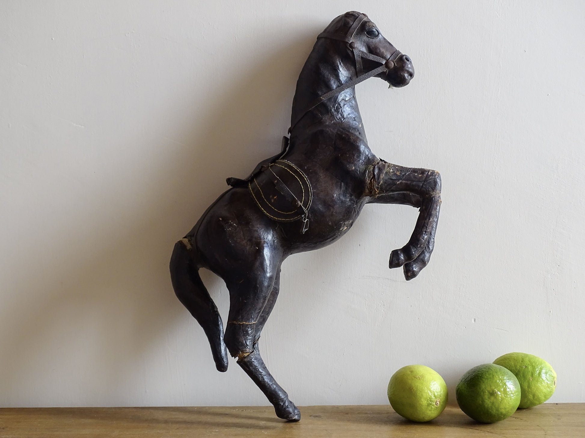 Distressed antique leather horse figurine for vintage shelf decor
