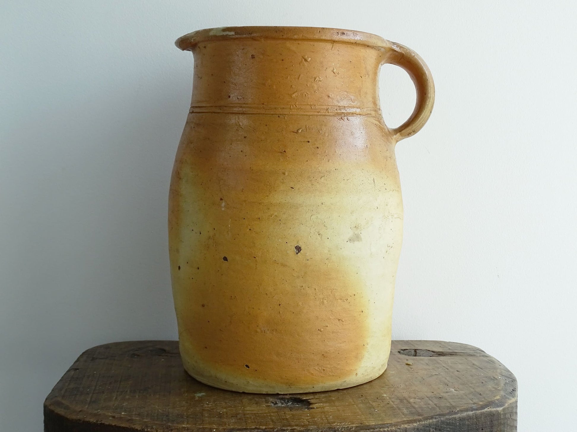 French antique pottery milk jug with orange tones for rustic farmhouse decor.