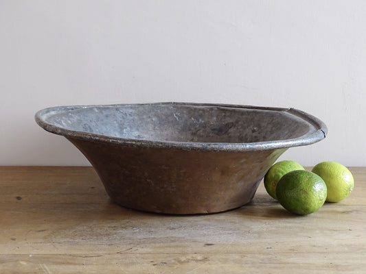 French antique tinned copper bowl with timeworn patina. Antique bowl that would make a rustic table centrepiece in French country farmhouse aesthetic.