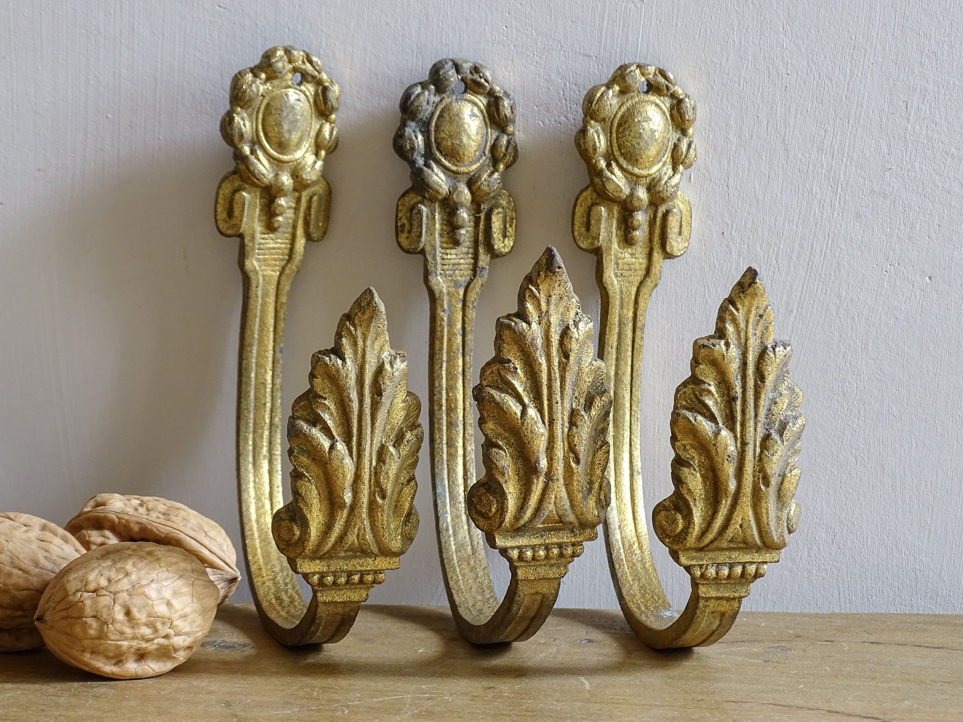 French antique gilt bronze curtain hooks with acanthus leaves