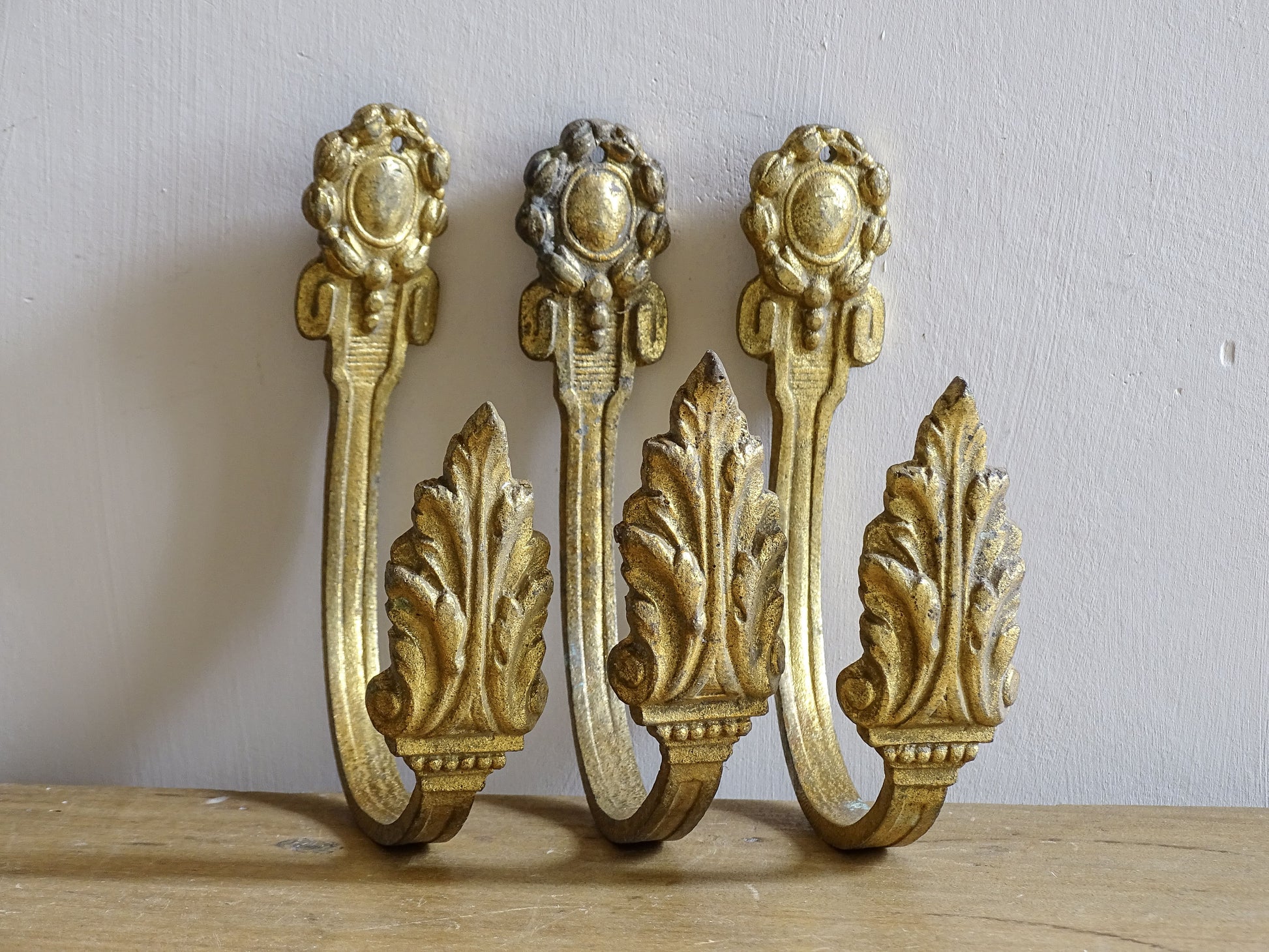 French antique gilt bronze curtain hooks with acanthus leaves