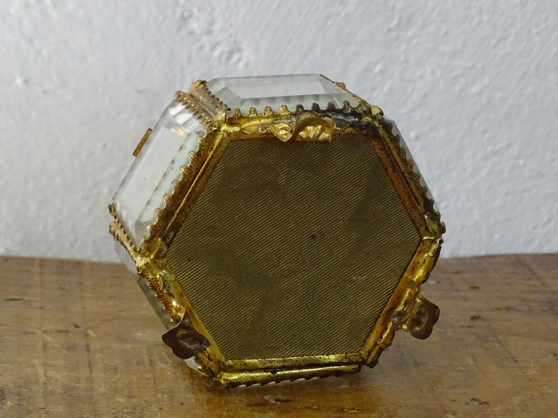 French antique glass jewelry box with bevelled glass, green silk cushion and gilt detailing