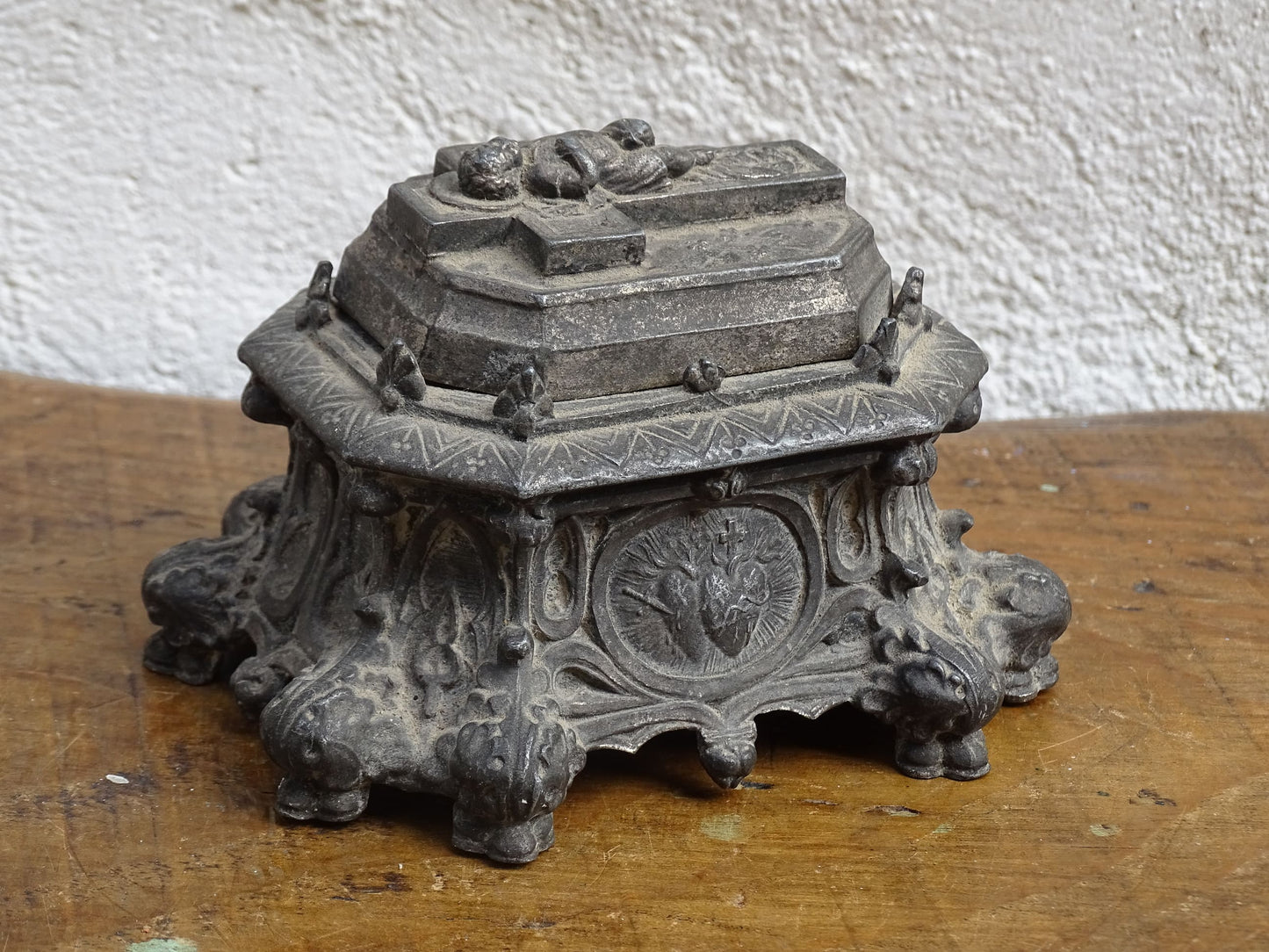 French antique pewter inkwell with religious decoration, it has a Cross and Sleeping Baby Jesus and Sacred Heart of Jesus Symbol