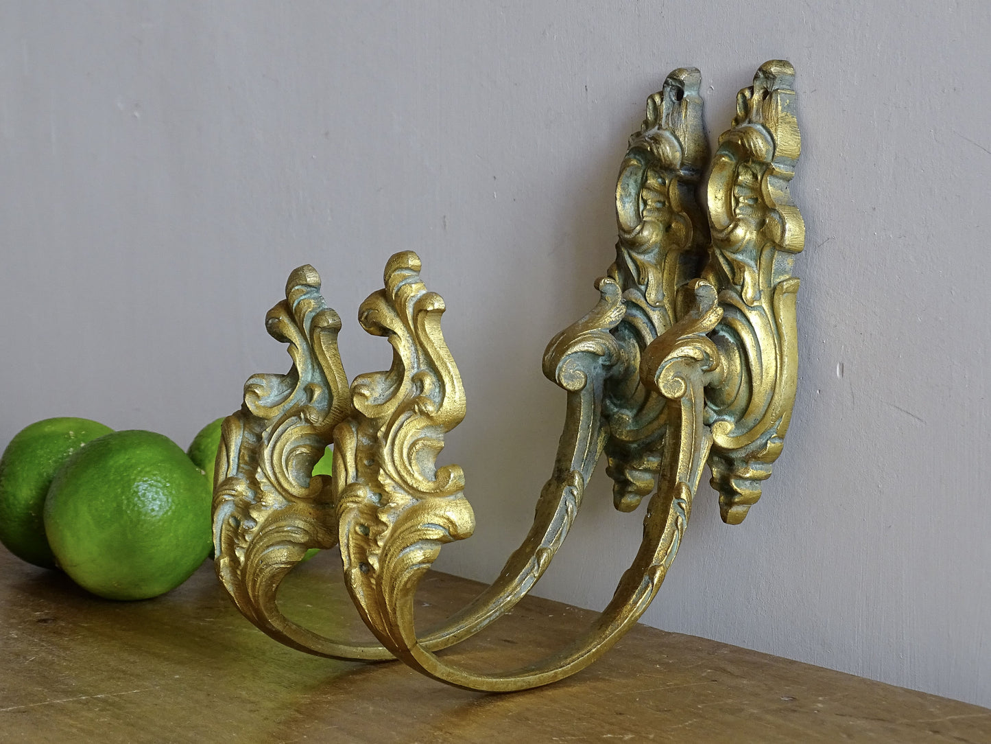 Pair of French antique gilt bronze curtain hooks