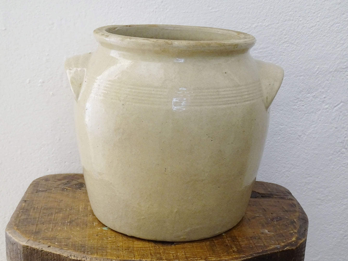 Rustic antique French stoneware confit pot. Glazed pottery cache pot in a pale oatmeal glaze. French farmhouse style home decor.