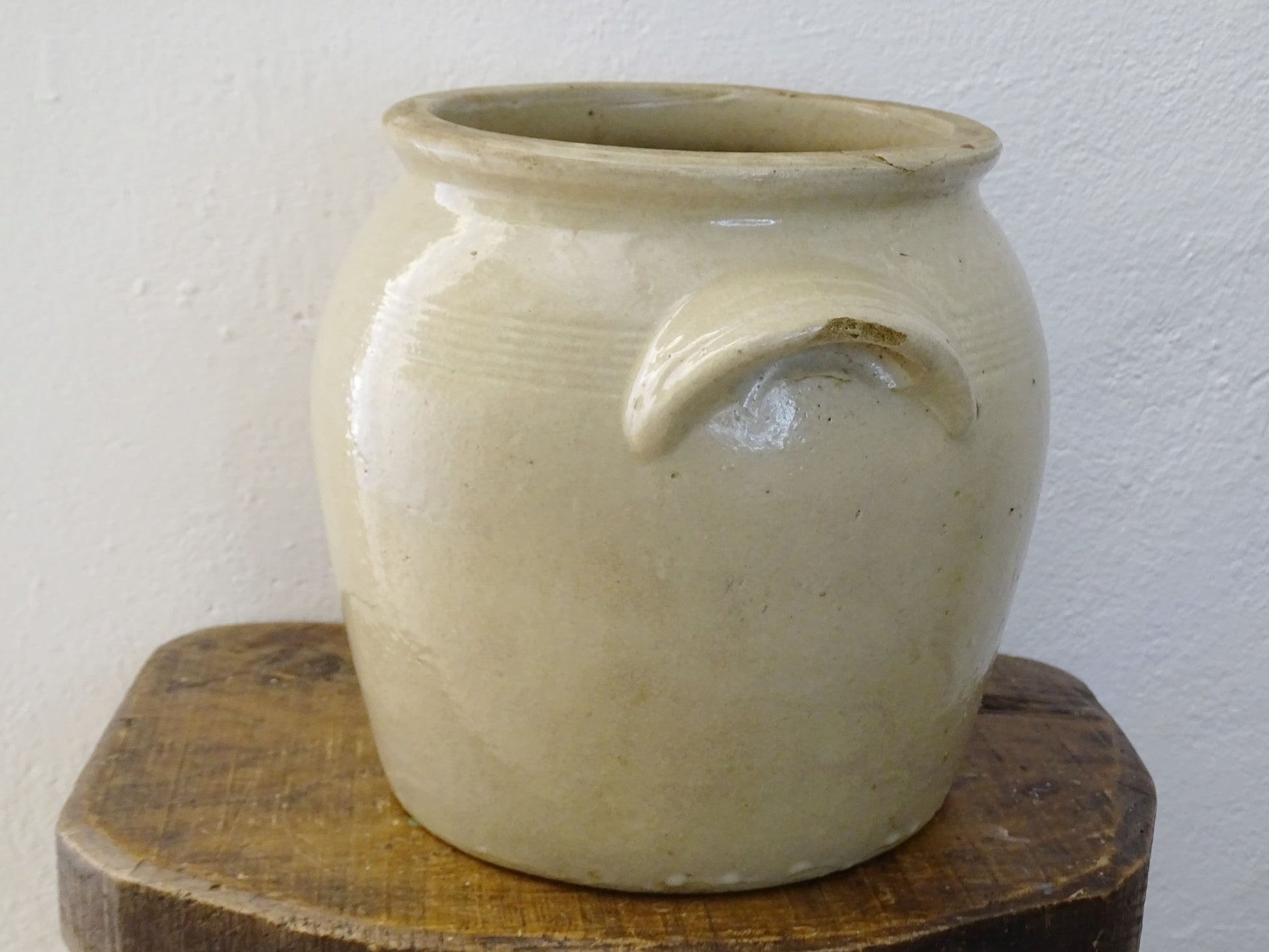 Rustic antique French stoneware confit pot. Glazed pottery cache pot in a pale oatmeal glaze. French farmhouse style home decor.