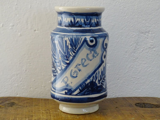 a vintage Spanish Catalan Albarello Pottery Pharmacy jar it is tin-glazed and hand-painted in blue and white