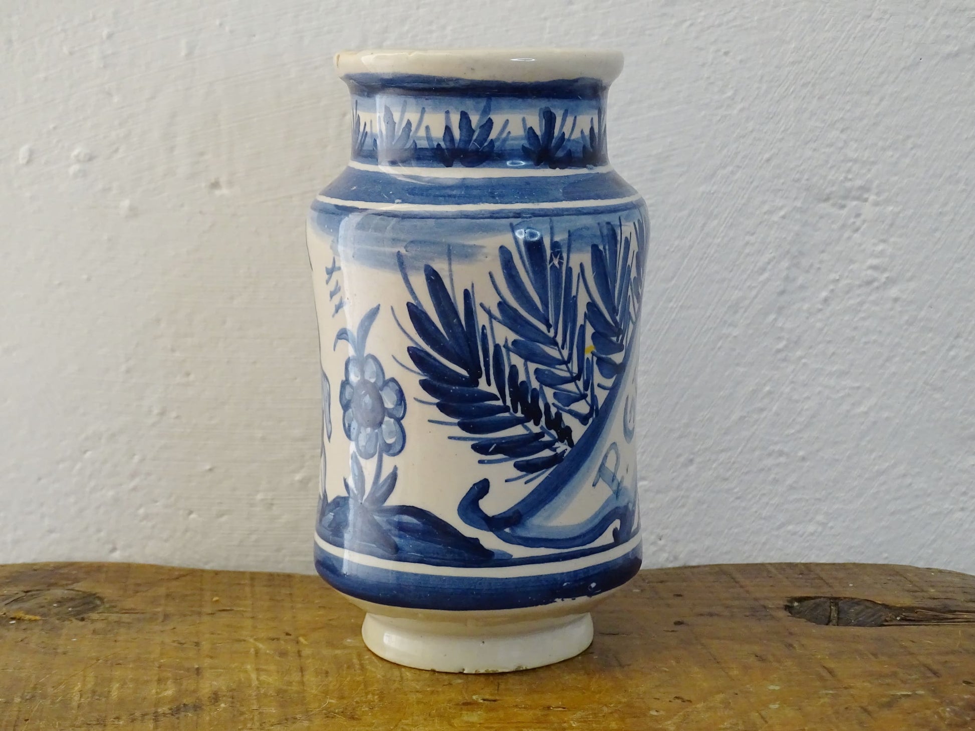 a vintage Spanish Catalan Albarello Pottery Pharmacy jar it is tin-glazed and hand-painted in blue and white