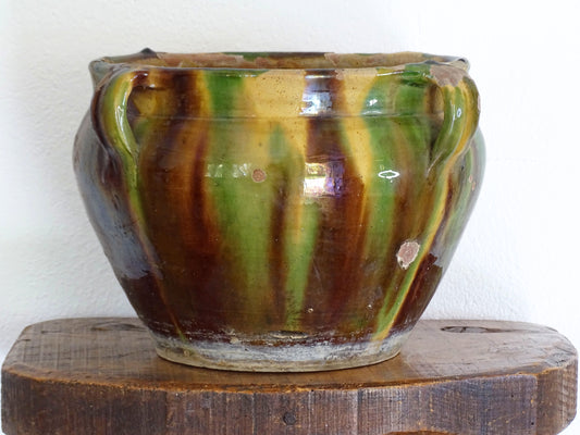 French antique terracotta planter with a stripe drip glaze in yellow, green and brown . Pottery planter from Castelnaudary. Antique ceramic jardinière or ceramic cachepot.