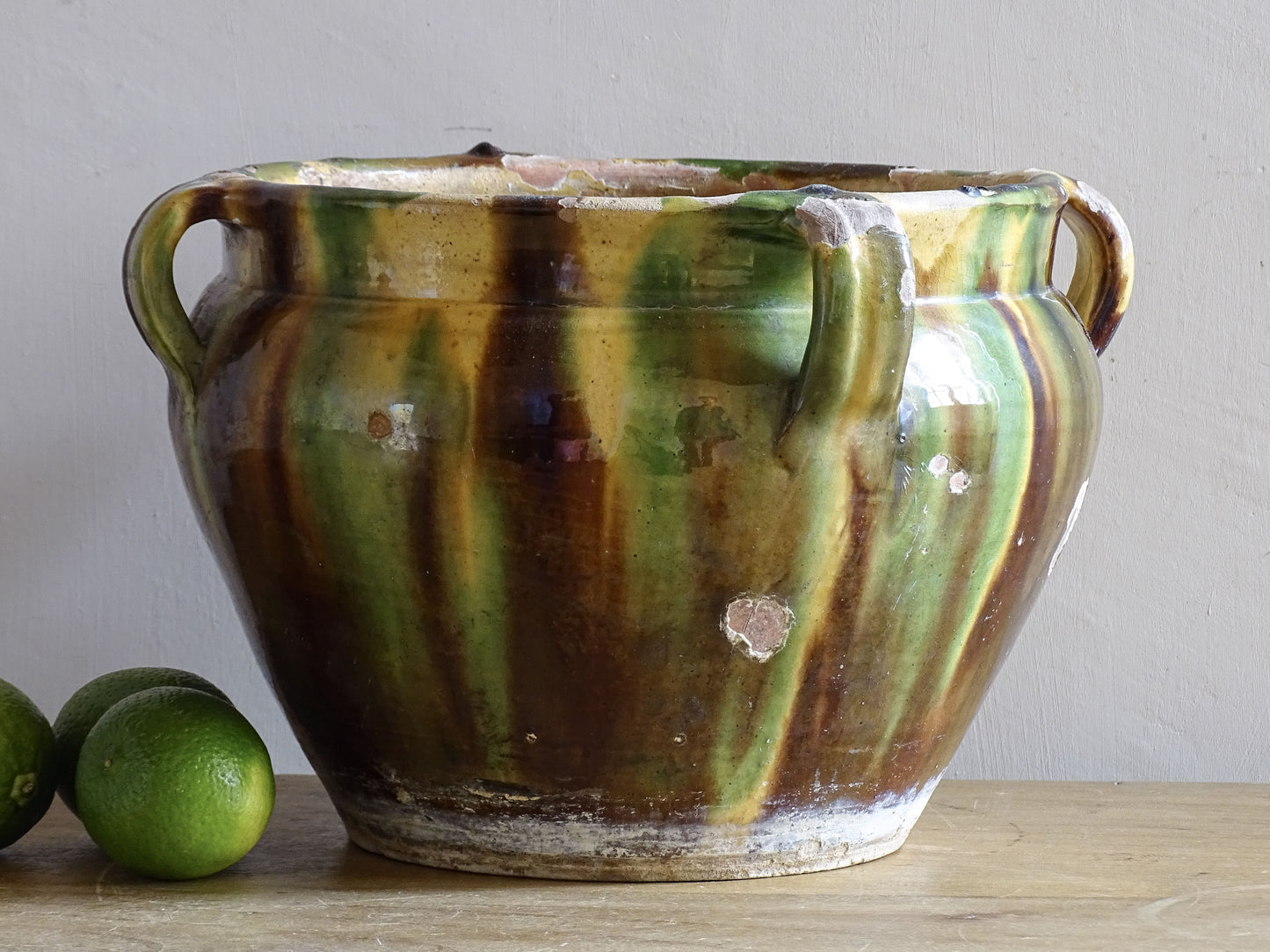 French antique ceramic planter from Castelnaudary. Pottery cache pot with a green, brown and yellow glaze
