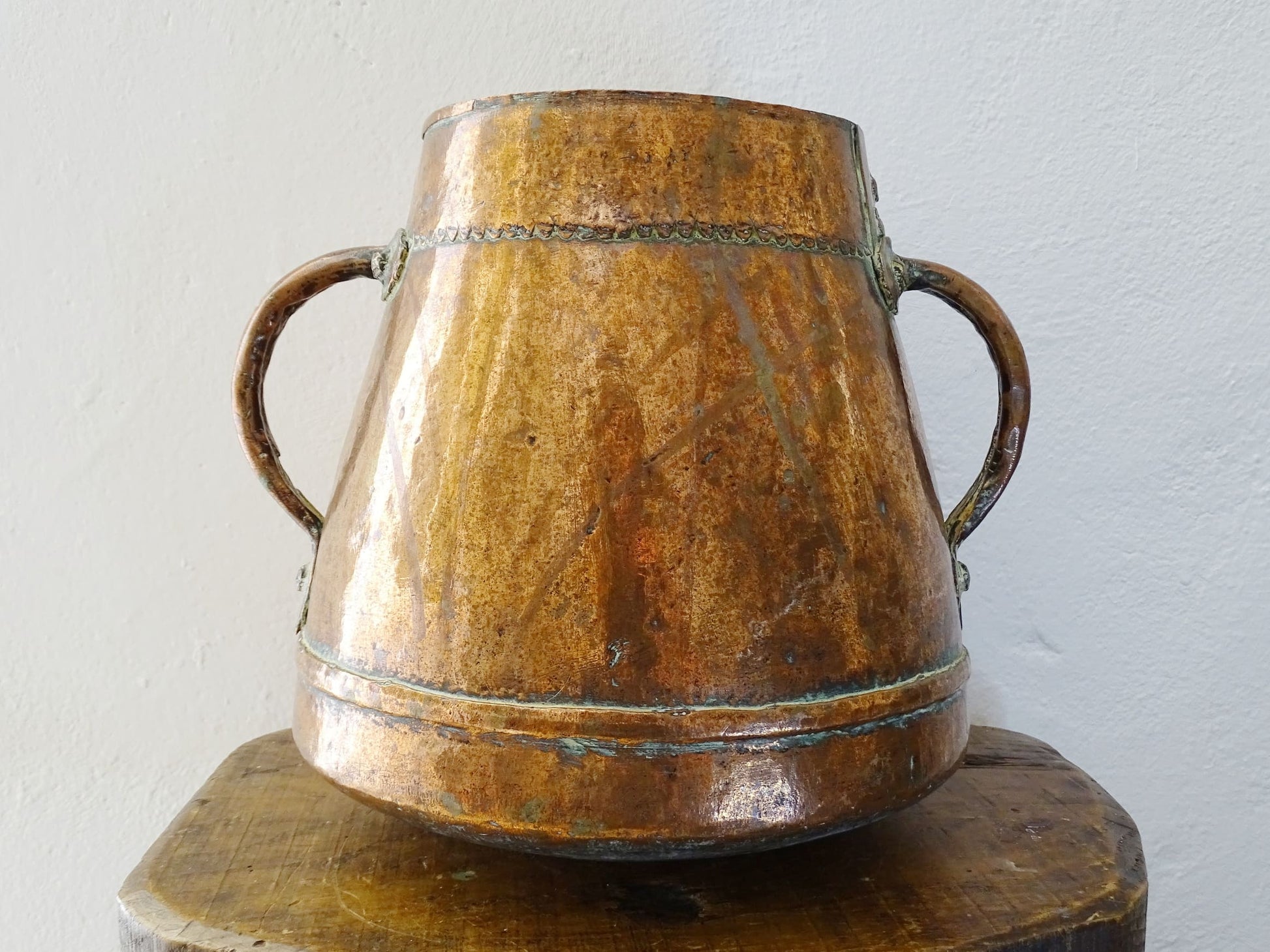 tapered antique french copper vessel or pot with twin handles and a rounded bottom