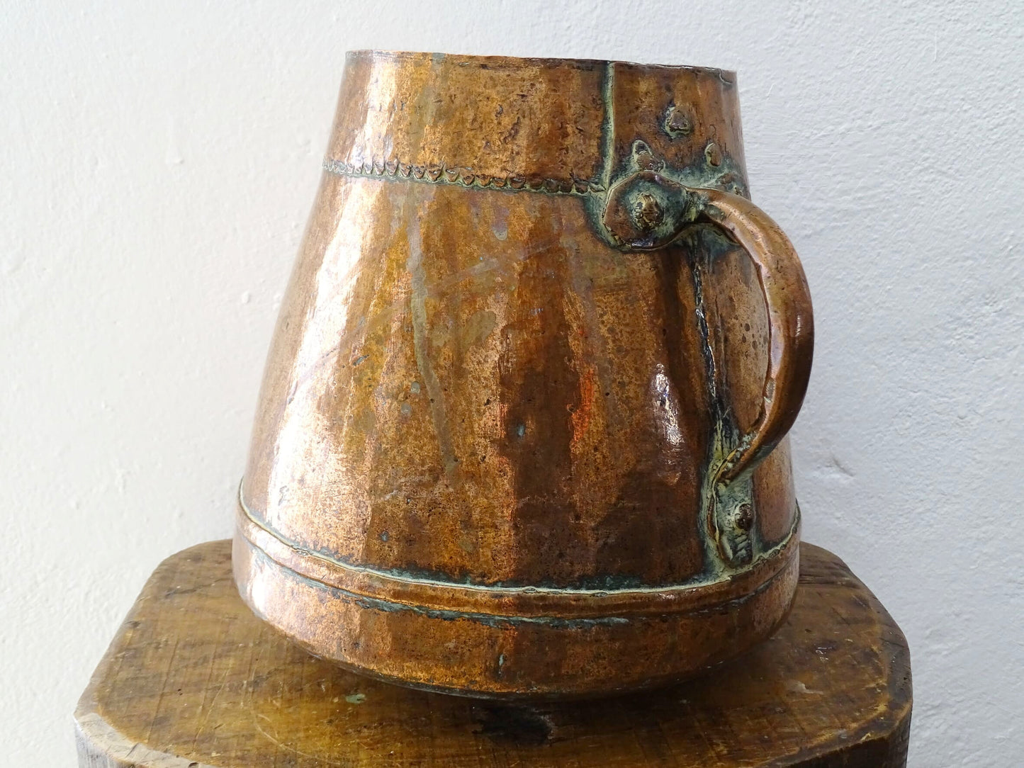 Tapered French antique copper vessel twin handles and a rounded base. Antique copper pot for French countryside decor.