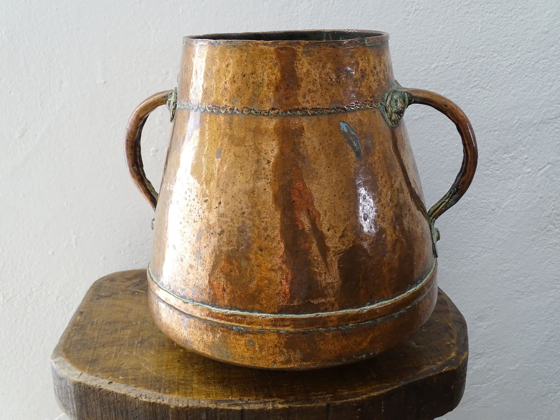 tapered antique french copper vessel or pot with twin handles and a rounded bottom