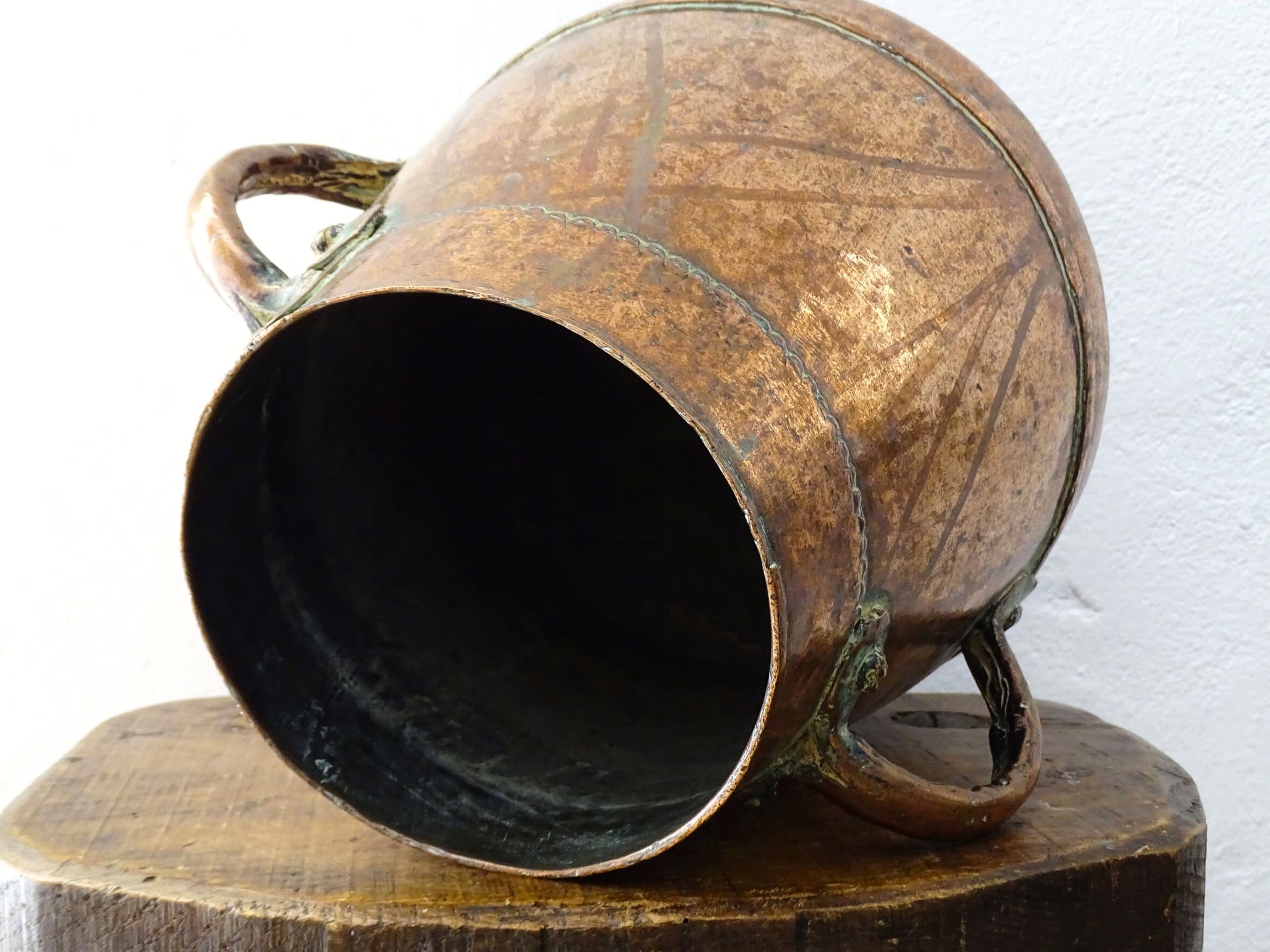 Tapered French antique copper vessel twin handles and a rounded base. Antique copper pot for French countryside decor.