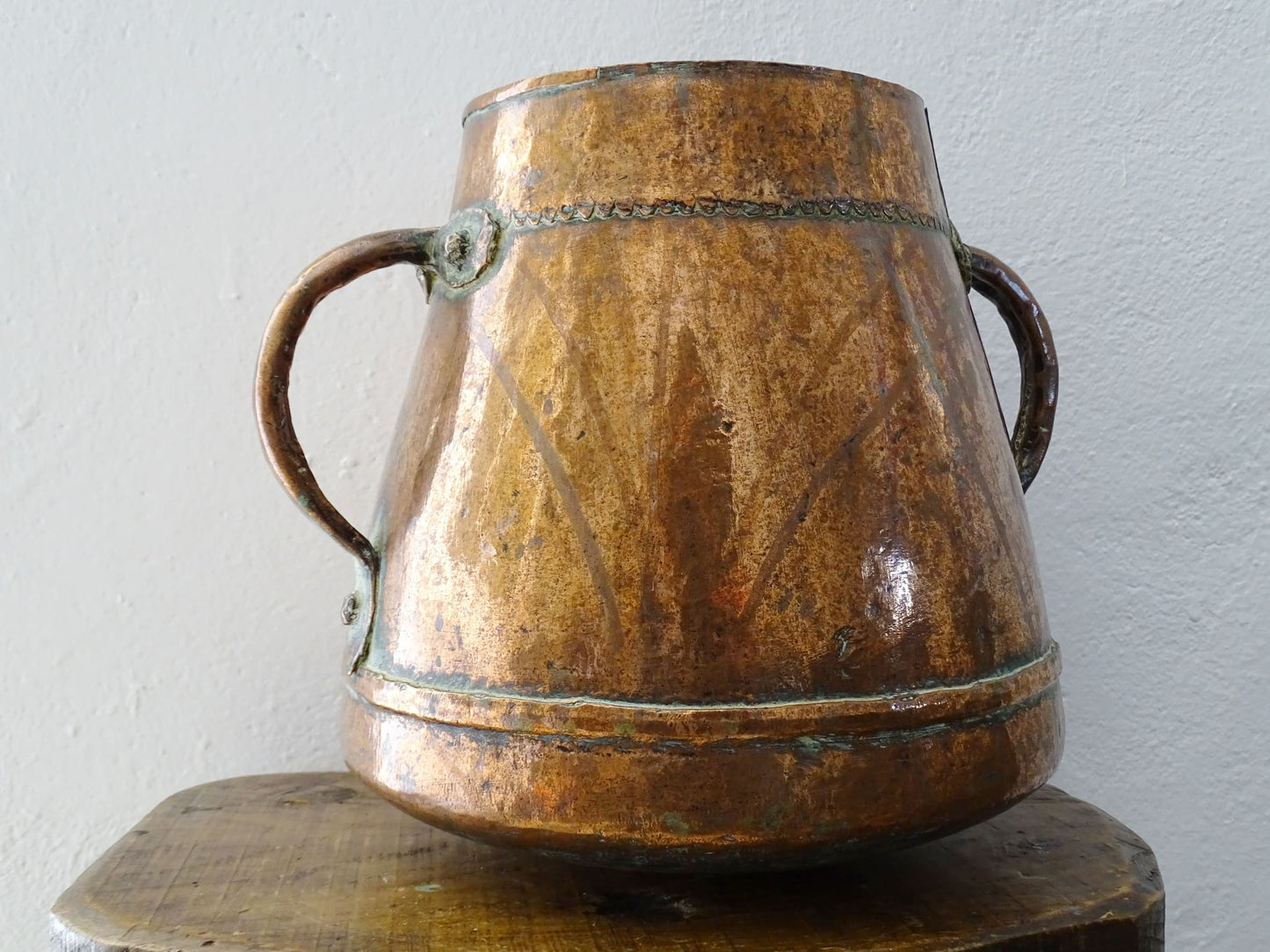 tapered antique french copper vessel or pot with twin handles and a rounded bottom