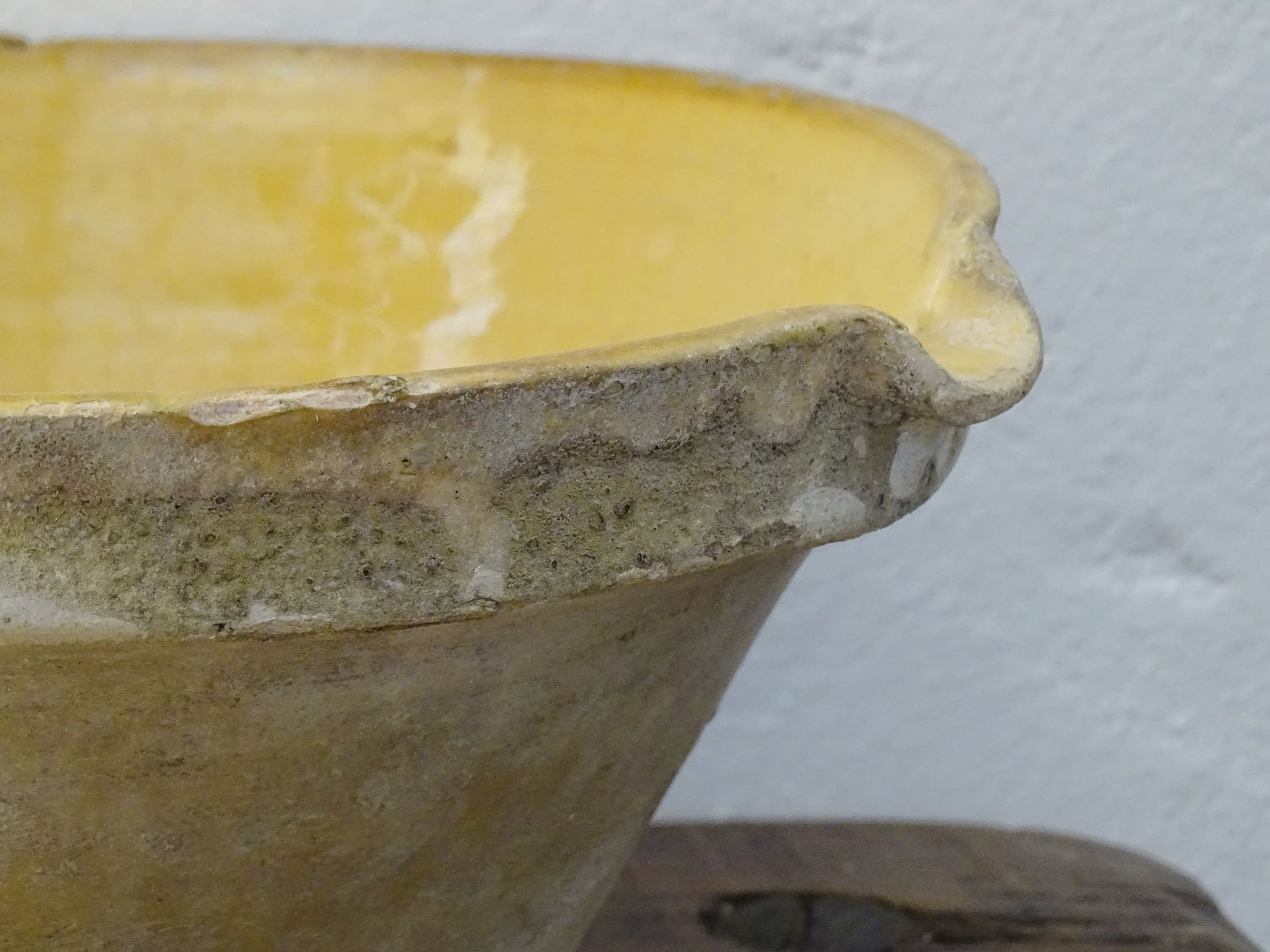 Antique French terracotta pottery tian or bowl with a yellow glaze to the interior. The earthenware gresale has no glaze to the outside and has a rustic appearance. 