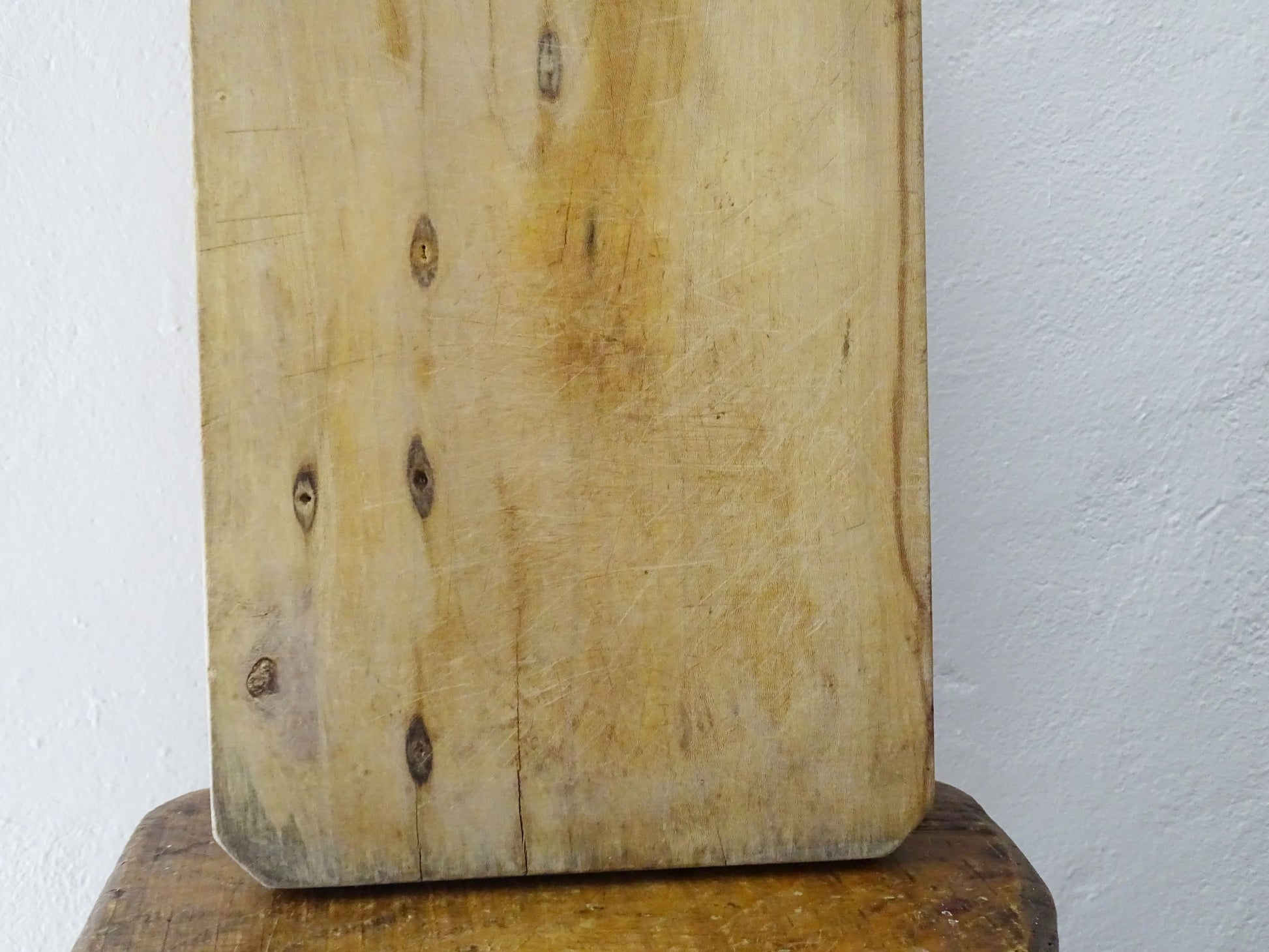 Vintage rustic French wooden cutting or chopping board, this vintage block with patina has a long handle.