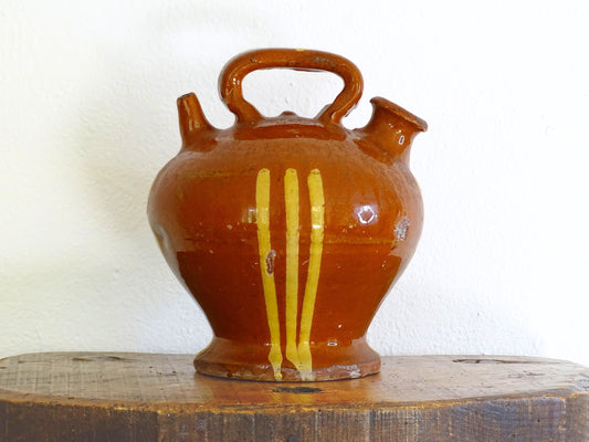 French antique pottery jug with red glaze and yellow stripe