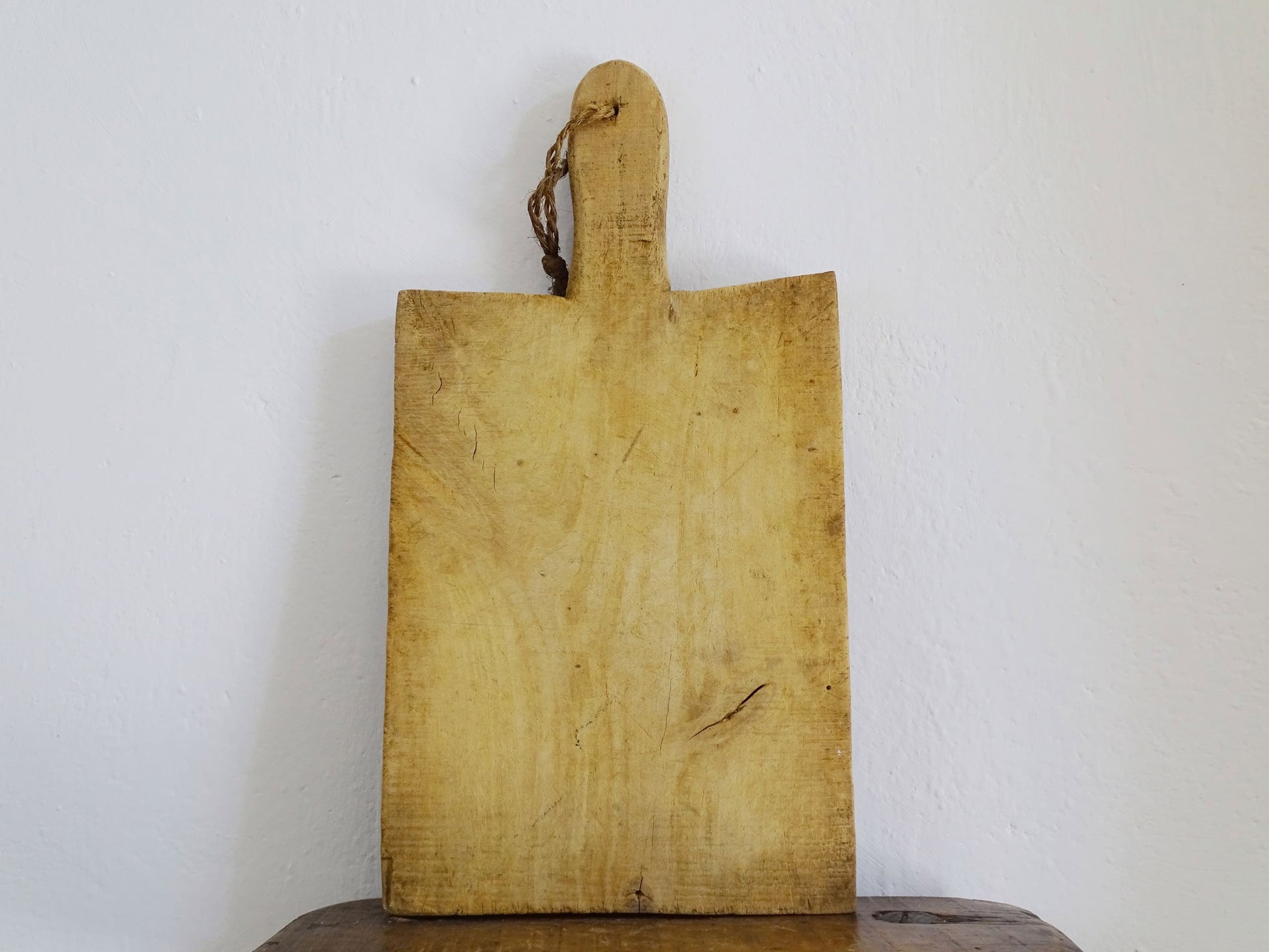 French antique wooden cutting board or chopping board with handle and rich patina