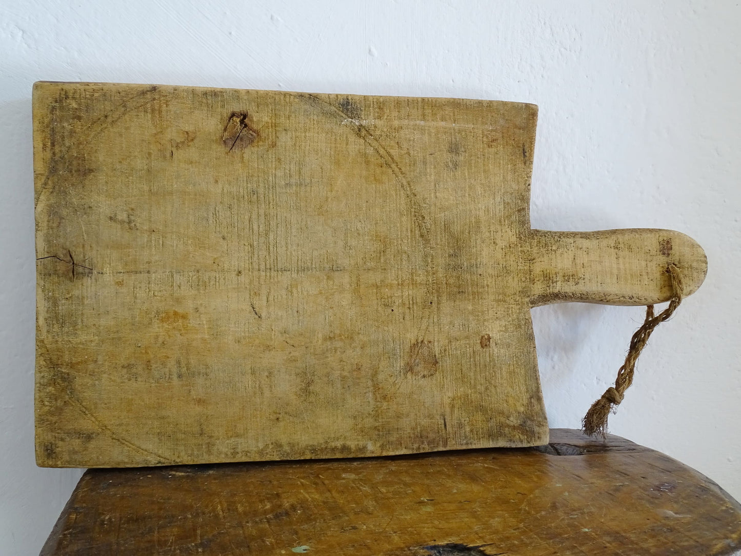 French antique wooden cutting board or chopping board with handle and rich patina