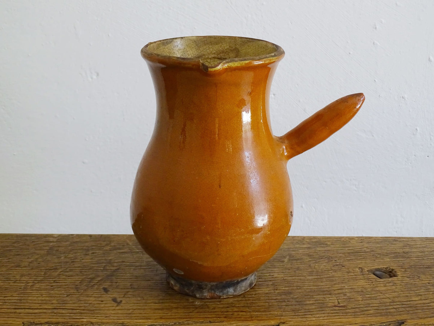 French antique glazed terracotta jug with side handle and red rust colour