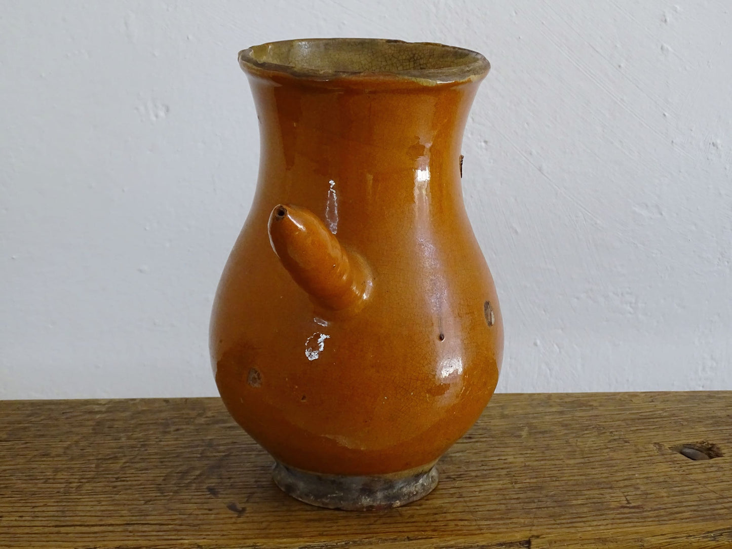 French antique glazed terracotta jug with side handle and red rust colour