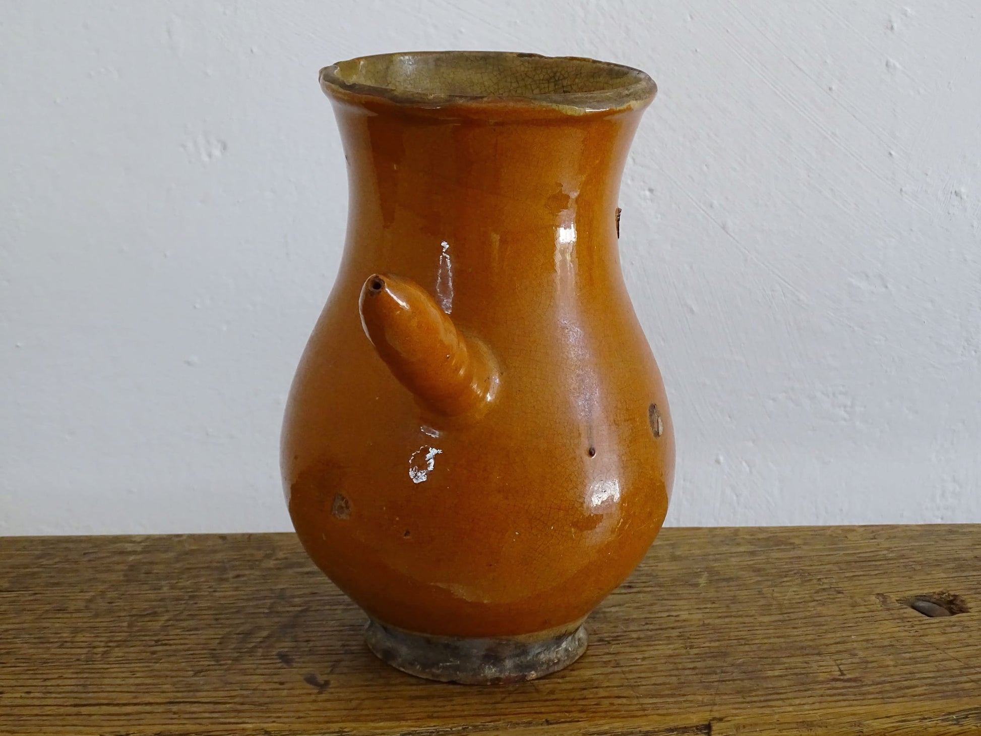 French antique glazed terracotta jug with side handle and red rust colour