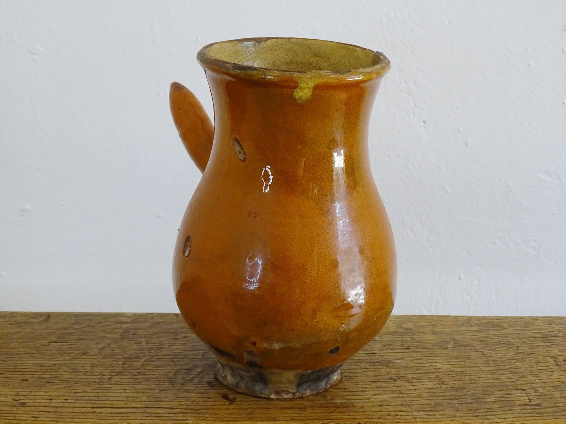 French antique glazed terracotta jug with side handle and red rust colour