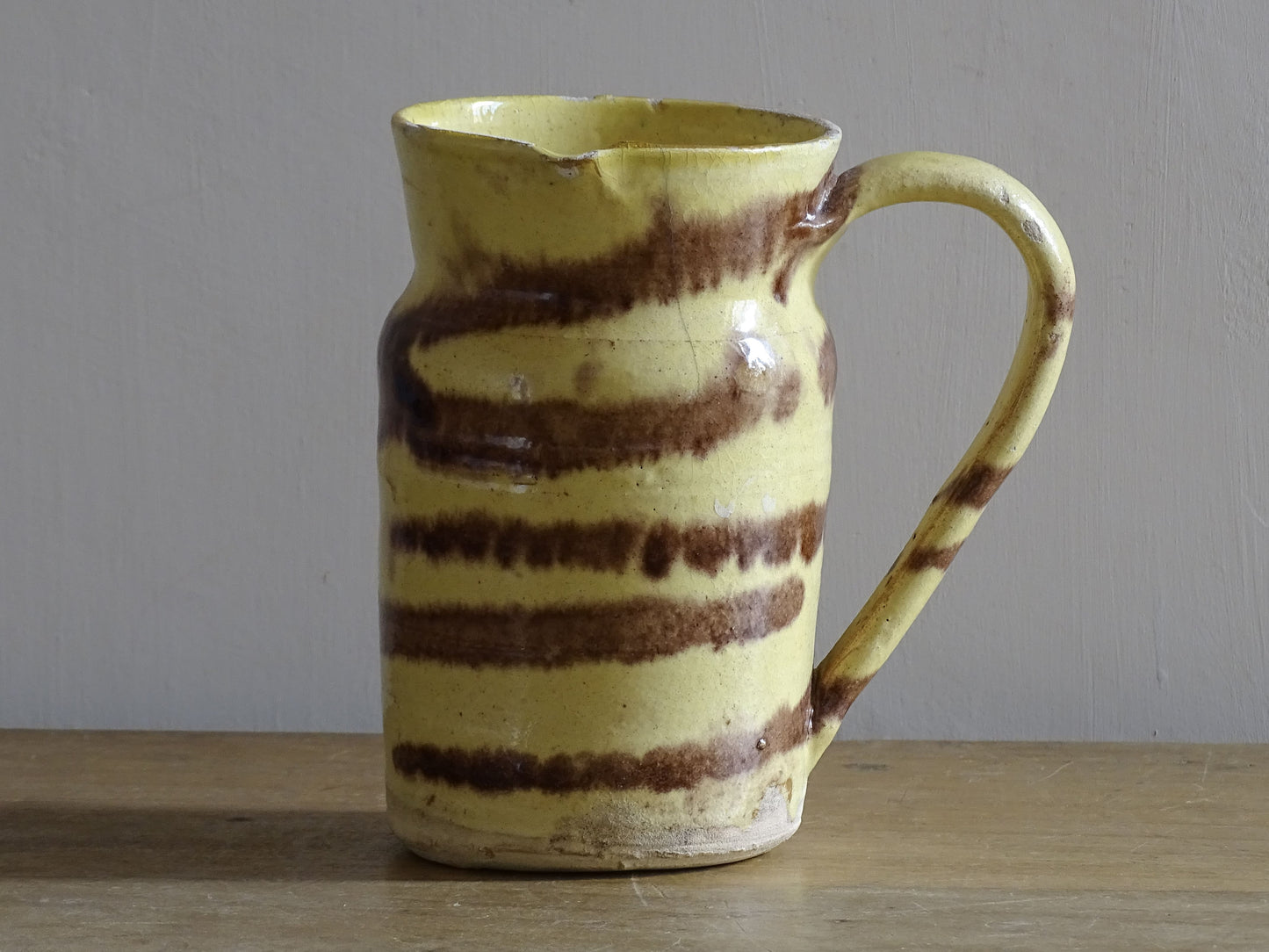 French antique ceramic jug with yellow and brown glaze. Dieulefit pottery.