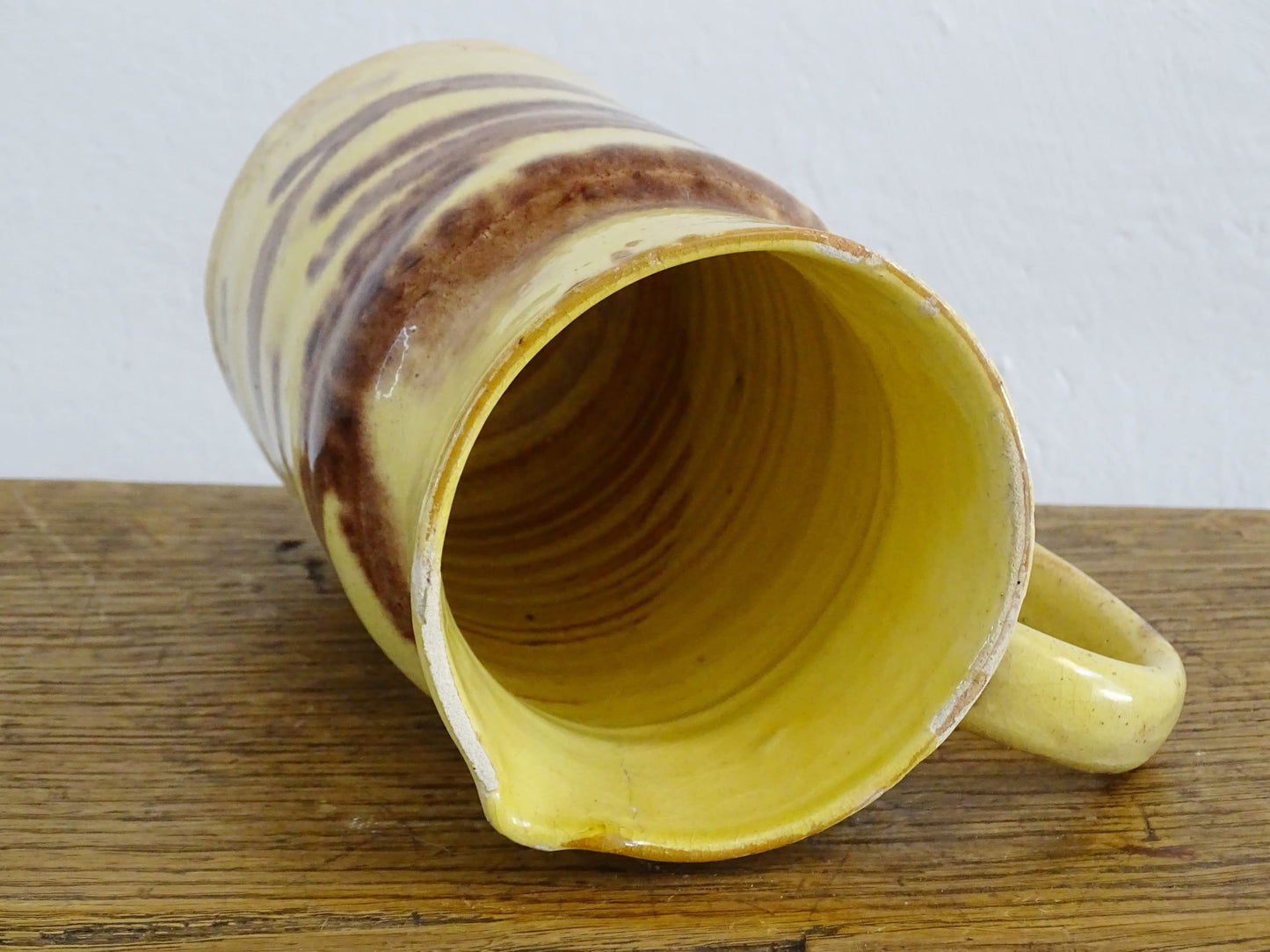 French antique ceramic jug from Dieulefit with a yellow glaze with brown drip glaze stripe.